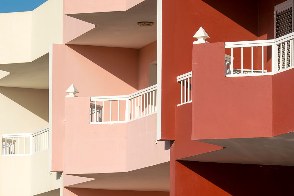 Painted house exterior in bright sun.