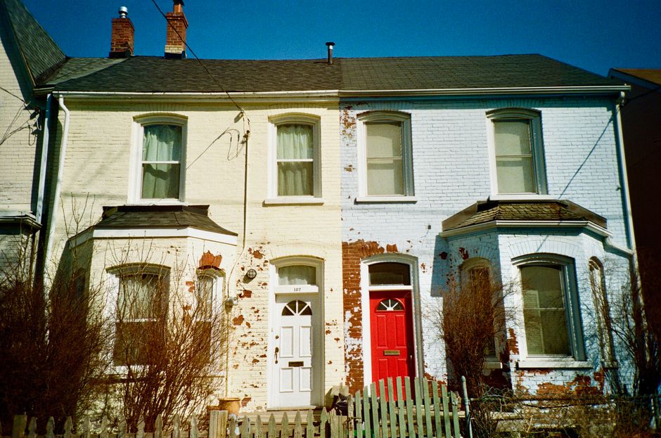 Row of houses with painted doors.