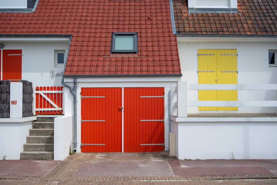 Painted house front with colored doors.